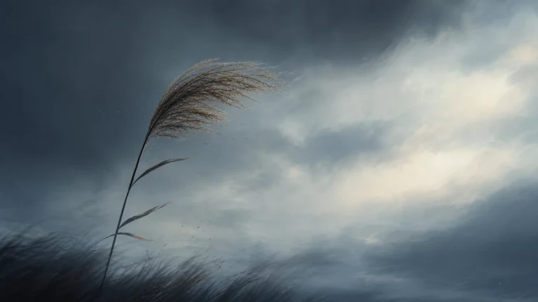 一根芦苇在浓重乌云和强风中弯向一侧