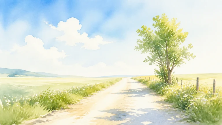 晴空草原上的乡间道路绕过一棵翠绿树木